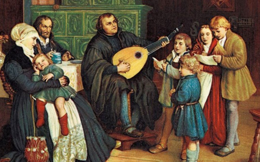 Man playing instrument in front of people and children